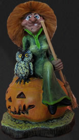 Witch with owl on pumpkin